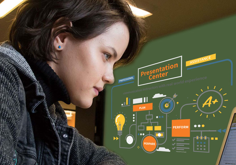 Female student using computer in presentation center